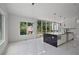 Bright open-concept kitchen featuring an island with modern fixtures and a window with a view at 1410 Lavista Ne Rd, Atlanta, GA 30324