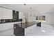 Modern kitchen featuring sleek countertops, a large island, and white cabinets at 1410 Lavista Ne Rd, Atlanta, GA 30324