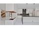 Contemporary kitchen with stylish island, white cabinetry, and premium black stainless steel appliances at 1410 Lavista Ne Rd, Atlanta, GA 30324