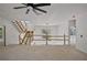 Bright living room with stairs, ceiling fan, and natural light from a window at 1410 Lavista Ne Rd, Atlanta, GA 30324