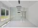 Modern living room with large windows and glass wall looking into a dining area at 1410 Lavista Ne Rd, Atlanta, GA 30324