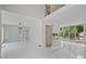 Bright open living area with large windows, gleaming floors, and access to outdoor deck at 1410 Lavista Ne Rd, Atlanta, GA 30324