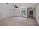Spacious living room featuring ceiling fan and natural light from a large window at 1410 Lavista Ne Rd, Atlanta, GA 30324