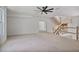 Open living room with stairs, ceiling fan, and neutral tones at 1410 Lavista Ne Rd, Atlanta, GA 30324