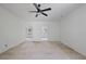 Large room with unfinished floors, bright natural light, and two entry ways at 1410 Lavista Ne Rd, Atlanta, GA 30324