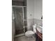 Tiled bathroom featuring a glass door shower and updated sink at 2379 Manassas Ln, Decatur, GA 30034