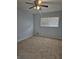 Bright bedroom features neutral carpet, a ceiling fan, and a window with white blinds at 2379 Manassas Ln, Decatur, GA 30034
