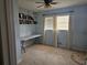 Cozy bedroom with a window, beige carpet, and built-in shelves over the workstation at 2379 Manassas Ln, Decatur, GA 30034