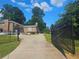 Long private driveway leads to a brick home with lush landscaping at 2379 Manassas Ln, Decatur, GA 30034