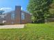 Brick home with arched windows and well-maintained lawn at 2379 Manassas Ln, Decatur, GA 30034