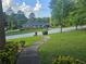 Traditional home with a well-kept lawn and a paved walkway at 2379 Manassas Ln, Decatur, GA 30034