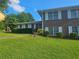 Well-maintained brick home featuring a lush green lawn and manicured shrubs at 2379 Manassas Ln, Decatur, GA 30034