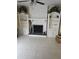 Brick fireplace framed by custom shelving and storage in this bright living room at 2379 Manassas Ln, Decatur, GA 30034