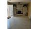 Cozy living room with a brick fireplace, built-in shelving and a ceiling fan at 2379 Manassas Ln, Decatur, GA 30034