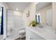 Clean bathroom featuring a shower-tub combo, vanity with lots of counter space and modern decor at 2440 Rocky City Ln, Snellville, GA 30078