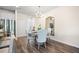 Cozy dining area with table set for four, modern chandelier, and a decorative mirror at 2440 Rocky City Ln, Snellville, GA 30078