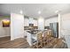 Modern kitchen featuring an island with seating, white cabinets, and stainless steel appliances at 2440 Rocky City Ln, Snellville, GA 30078