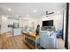 Bright living area flows to dining and kitchen, complete with console table and stylish decor at 2440 Rocky City Ln, Snellville, GA 30078