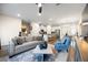 Inviting living room with open layout, modern decor, and seamless flow into dining and kitchen at 2440 Rocky City Ln, Snellville, GA 30078