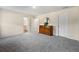 Large main bedroom featuring neutral walls and gray carpet, with bathroom and closet doors at 2440 Rocky City Ln, Snellville, GA 30078