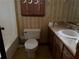Traditional bathroom features a sink, toilet, tub, and floral wallpaper at 108 Fair Oaks Se Dr, Conyers, GA 30094