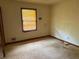 Simple bedroom with carpet flooring and a window at 108 Fair Oaks Se Dr, Conyers, GA 30094