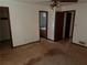 Empty bedroom leads to a bathroom and has an outdated ceiling fan and carpet at 108 Fair Oaks Se Dr, Conyers, GA 30094
