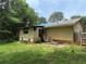 Rear exterior view of house showing yard, siding, and a covered area leading to the back door at 108 Fair Oaks Se Dr, Conyers, GA 30094