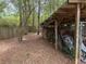 Exterior view of the open backyard storage area and the adjacent wooded area at 108 Fair Oaks Se Dr, Conyers, GA 30094