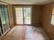 Enclosed sunroom with sliding doors and view of the backyard; ready for updating and personalization at 108 Fair Oaks Se Dr, Conyers, GA 30094