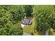 Aerial view of home with large green backyard, lush trees and a well-manicured lawn at 1870 Twin Branch Dr, Marietta, GA 30062