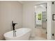 Bright bathroom features soaking tub and walk-in closet at 1870 Twin Branch Dr, Marietta, GA 30062
