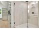 Bright bathroom features glass shower, open shelves, tile and recessed lighting at 1870 Twin Branch Dr, Marietta, GA 30062