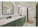 Stylish bathroom with double vanity, marble countertop, modern faucets, and decorative floor tiles at 1870 Twin Branch Dr, Marietta, GA 30062