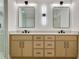 Bathroom features double sinks, quartz counters, sleek mirrors, and modern lighting at 1870 Twin Branch Dr, Marietta, GA 30062