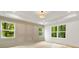 Bedroom with tray ceiling, natural light from multiple windows and stylish millwork at 1870 Twin Branch Dr, Marietta, GA 30062