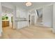 Open-concept entryway featuring light wood floors, white walls, and access to other living spaces at 1870 Twin Branch Dr, Marietta, GA 30062