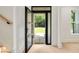 Light-filled entryway with a view to the front yard through the glass-paneled front door at 1870 Twin Branch Dr, Marietta, GA 30062