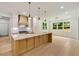 Spacious kitchen with stainless steel appliances, oversized island, and hardwood floors throughout the home at 1870 Twin Branch Dr, Marietta, GA 30062