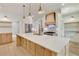 A modern kitchen with a large island, stainless steel appliances, and white shaker cabinets at 1870 Twin Branch Dr, Marietta, GA 30062