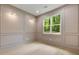 Office featuring a modern design with classic wall panels, hardwood floors, and plenty of natural light at 1870 Twin Branch Dr, Marietta, GA 30062