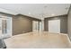 Spacious tiled basement room with recessed lighting and walk-out doors at 5882 Riverstone Cir # 15, Atlanta, GA 30339