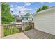 Wood deck offering views of nearby townhomes and surrounding green landscape at 5882 Riverstone Cir # 15, Atlanta, GA 30339
