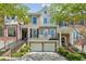 Beautiful townhouse with a brick facade, two-car garage, and charming curb appeal, perfect for modern living at 5882 Riverstone Cir # 15, Atlanta, GA 30339