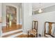 Elegant foyer featuring hardwood floors, stairs, and a view into other rooms, creating an inviting atmosphere at 5882 Riverstone Cir # 15, Atlanta, GA 30339