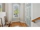 Light and airy foyer with hardwood floors, a large window, and a stylish front door, creating a welcoming entrance at 5882 Riverstone Cir # 15, Atlanta, GA 30339