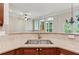 Open kitchen with granite countertops, stainless steel sink and a view to the living room at 5882 Riverstone Cir # 15, Atlanta, GA 30339