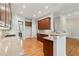 Gourmet kitchen featuring wooden cabinets, granite countertops, and bar seating at 5882 Riverstone Cir # 15, Atlanta, GA 30339