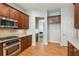 Well-equipped kitchen features wooden cabinets, granite countertops, and stainless steel oven at 5882 Riverstone Cir # 15, Atlanta, GA 30339