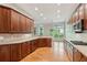 Spacious kitchen features wood cabinets, granite countertops, and stainless steel appliances at 5882 Riverstone Cir # 15, Atlanta, GA 30339